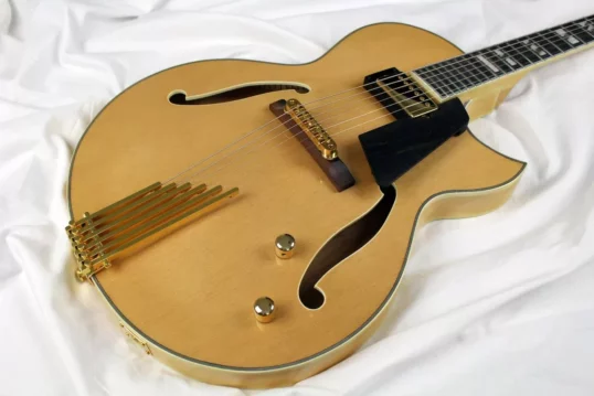 Natural Blonde jazz guitar with gold finger tailpiece